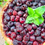 Top view of a Cherry Tart with mint