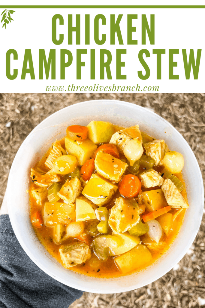 Pin image of a hand holding a bowl of Chicken Campfire Stew with title at top
