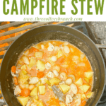 Pin image of Chicken Campfire Stew cooking on a fire with title at top