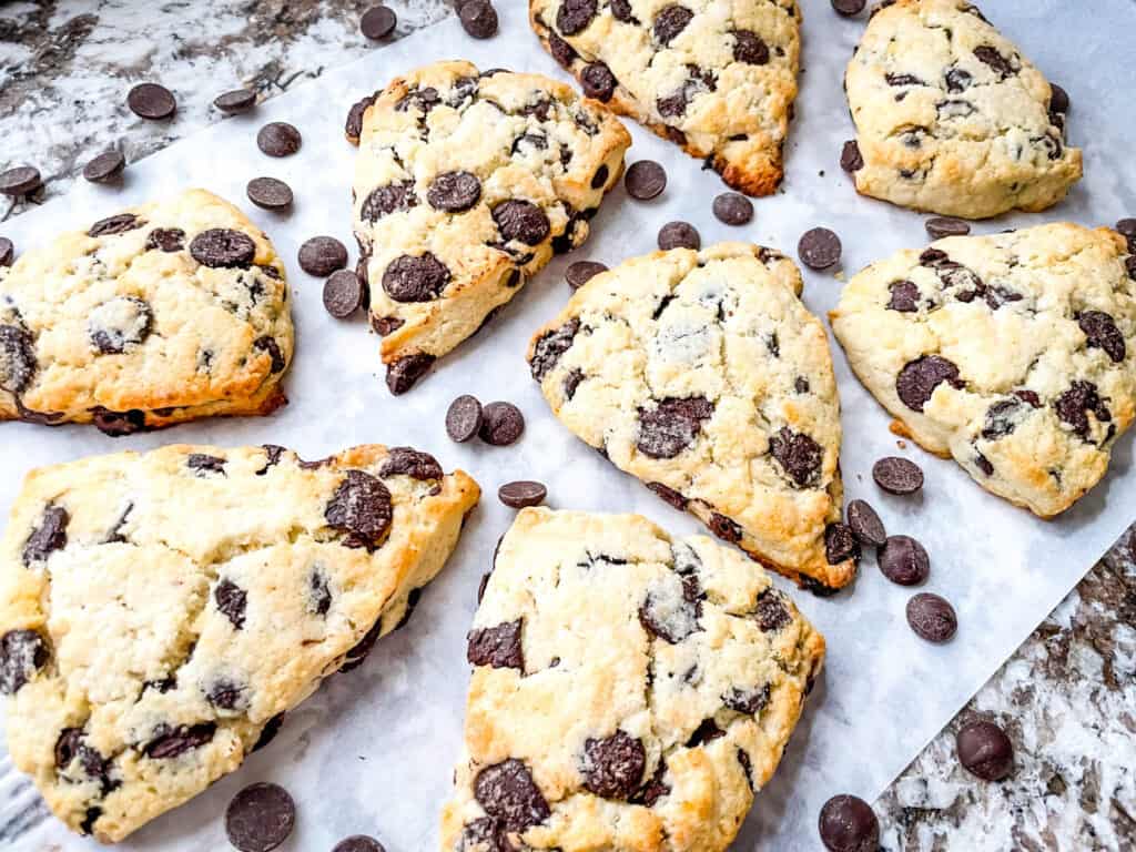 Several pastries scattered on parchment