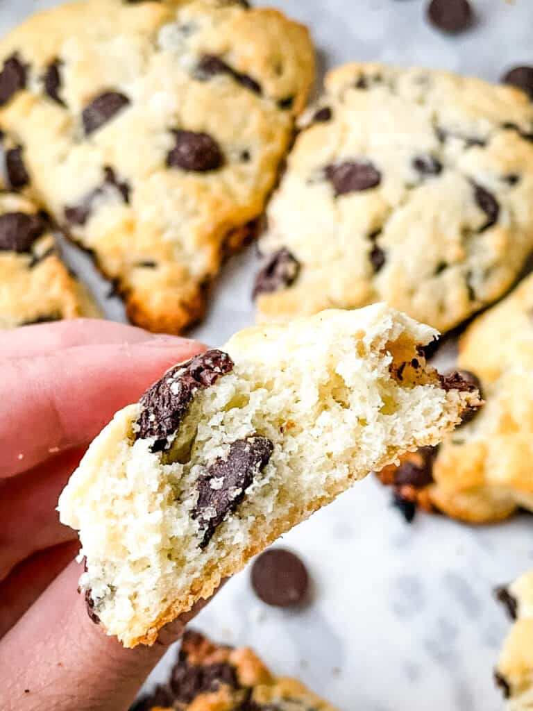 A hand holding a piece of the pastry