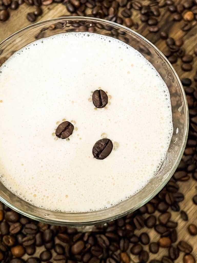 Top view of the cocktail with three coffee beans floating on top
