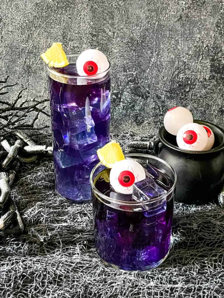 Two purple drinks decorated with eyes