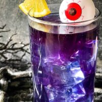 Close up of one Purple People Eater Halloween Cocktail (+Mocktail)