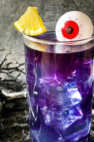 Close up of one Purple People Eater Halloween Cocktail (+Mocktail)