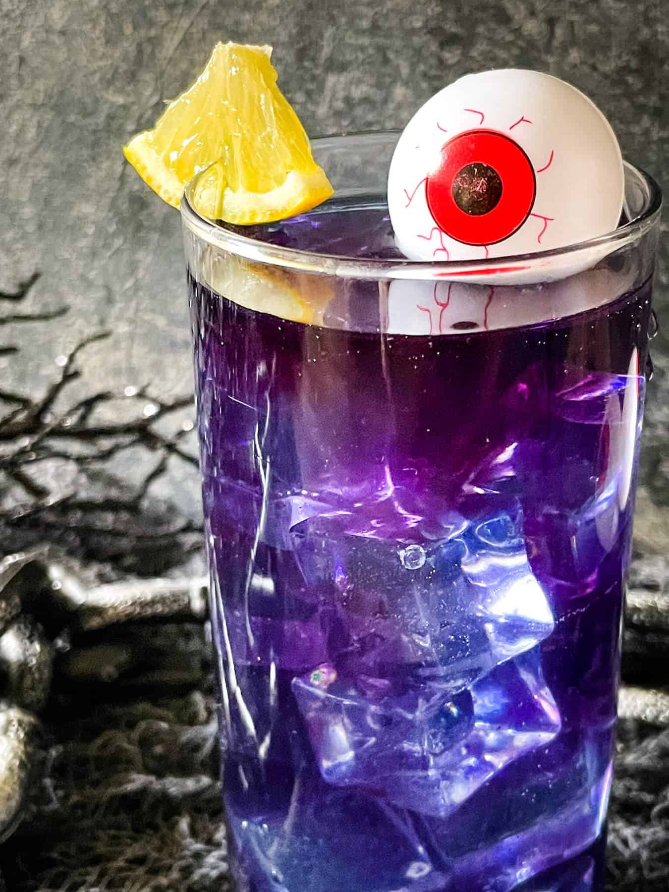 Close up of one Purple People Eater Halloween Cocktail (+Mocktail)