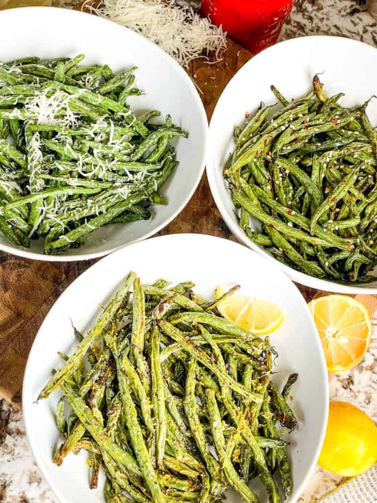 Three bowls full of the Air Fryer Green Beans (3 Ways) flavors