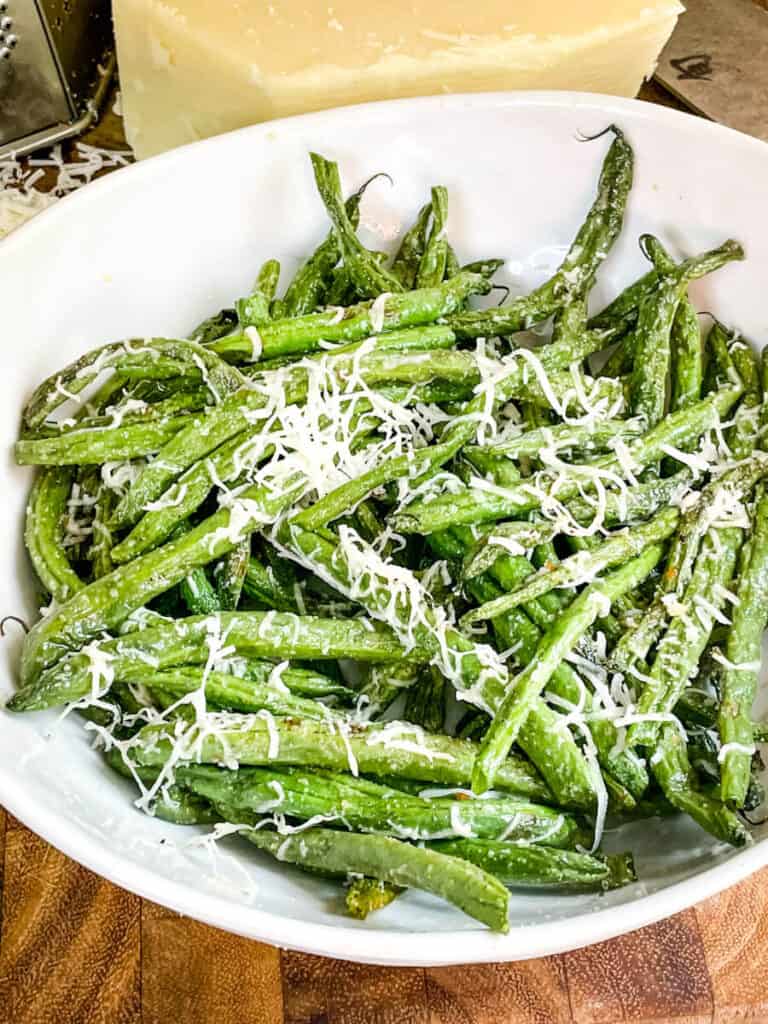 Beans with cheese on them in a bowl