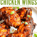 Pin image of Barbeque Chicken Wings on a white plate with title at top