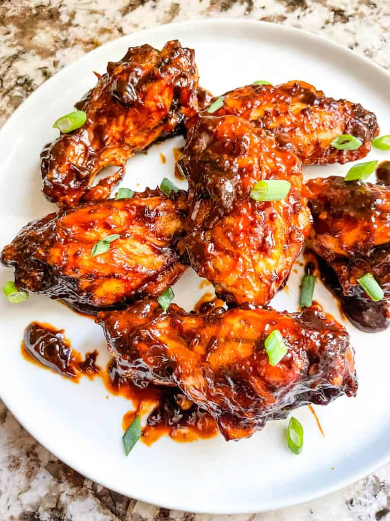 Barbeque Chicken Wings on a white round plate