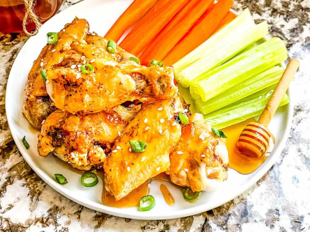 The wings on a plate with vegetables
