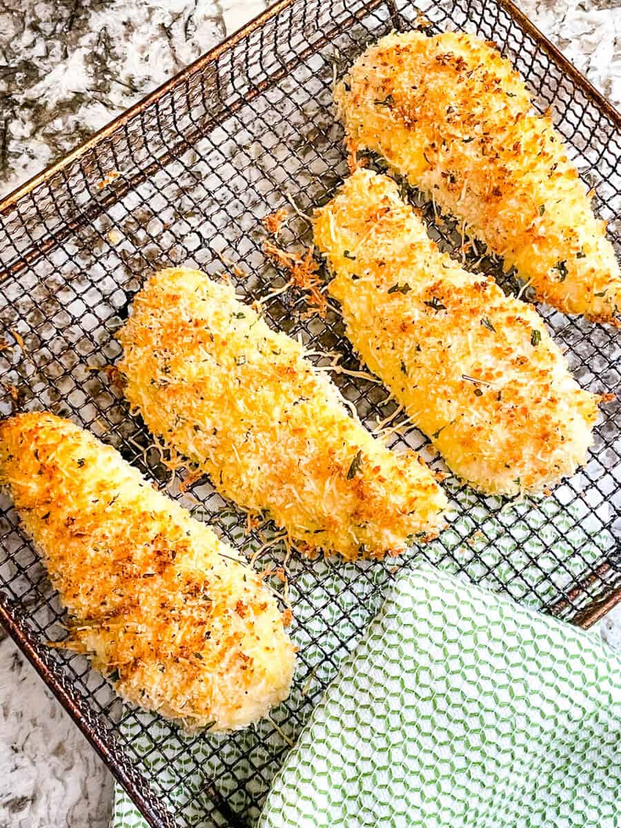 Parmesan Air Fried Chicken Tenders in an air fryer basket