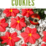 Pin image of Poinsettia Cookies spread out on a counter with title at top