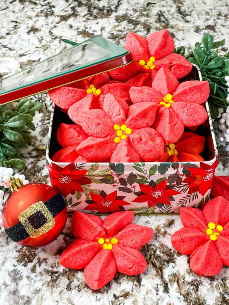 A tin full of Poinsettia Cookies