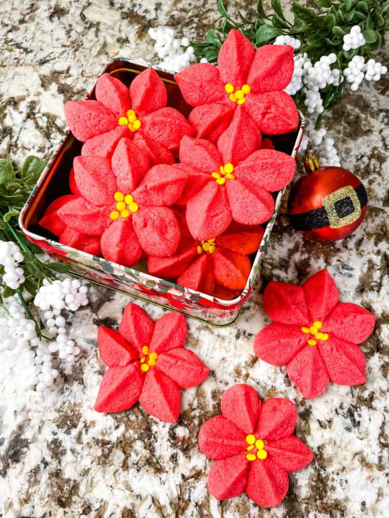 Top view of the Poinsettia Cookies in a tin