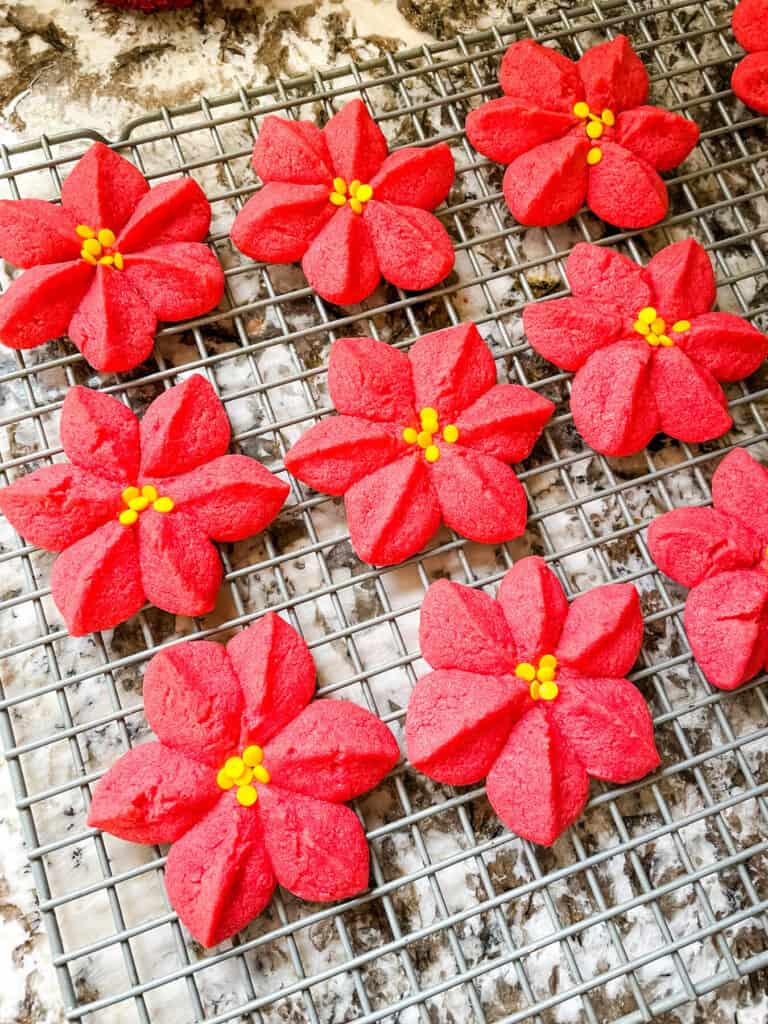 Poinsettia Cookies cooling on a rack