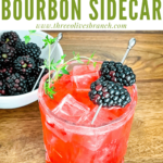 Pin of Blackberry Bourbon Sidecar with berries and thyme with title at top