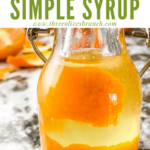 Pin for Orange Simple Syrup in a bottle close up