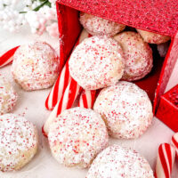 Peppermint Snowball Cookies pouring out of a little red box