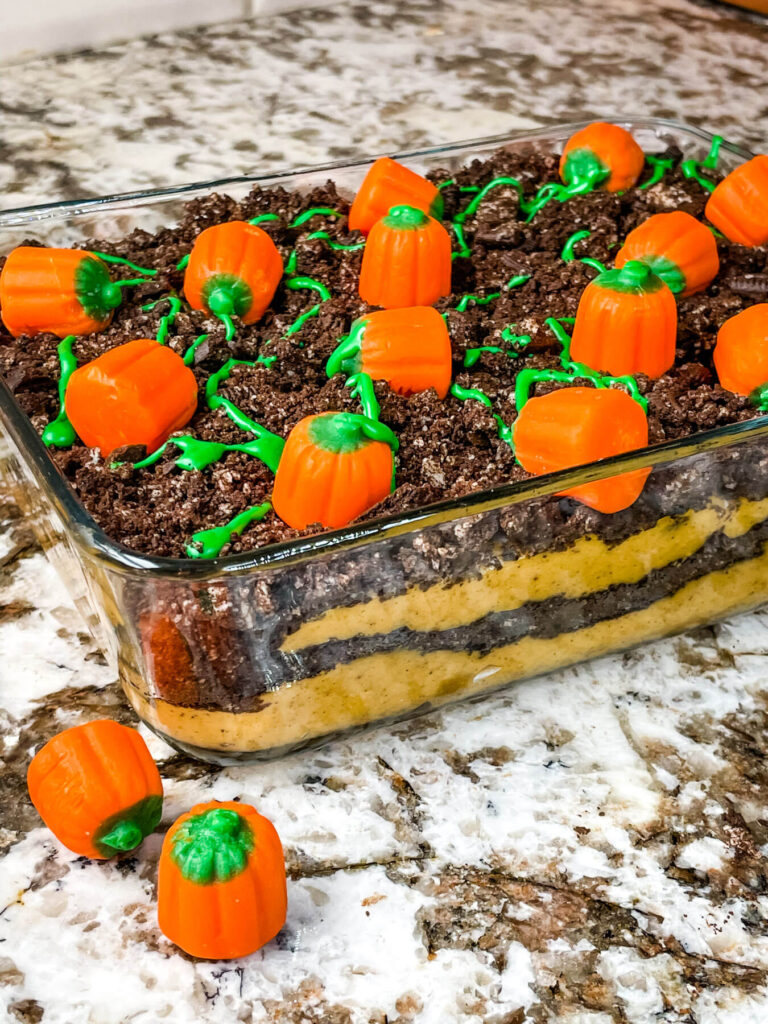 A large dish with the Pumpkin Patch Dirt Pudding Dessert in it