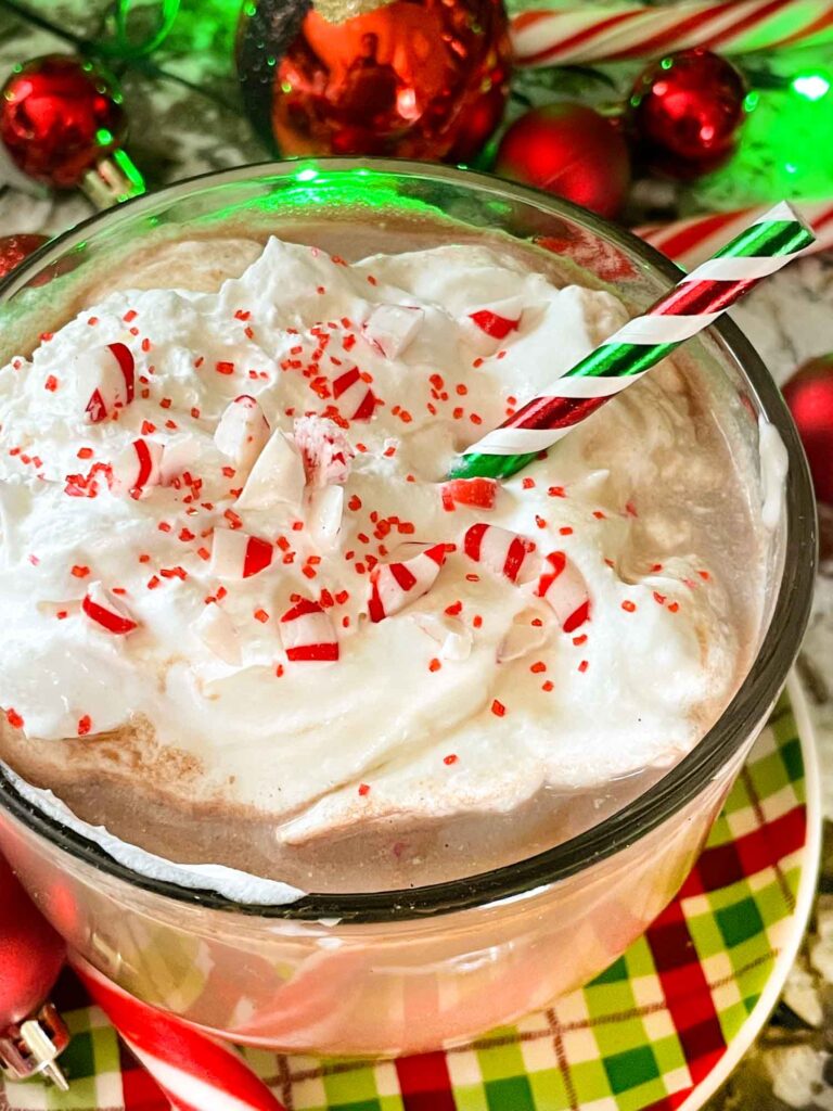 Holly Jolly Christmas Cocktail with whipped cream in a mug