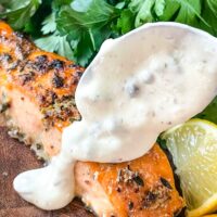 A spoon scooping remoulade sauce onto Air Fry Salmon
