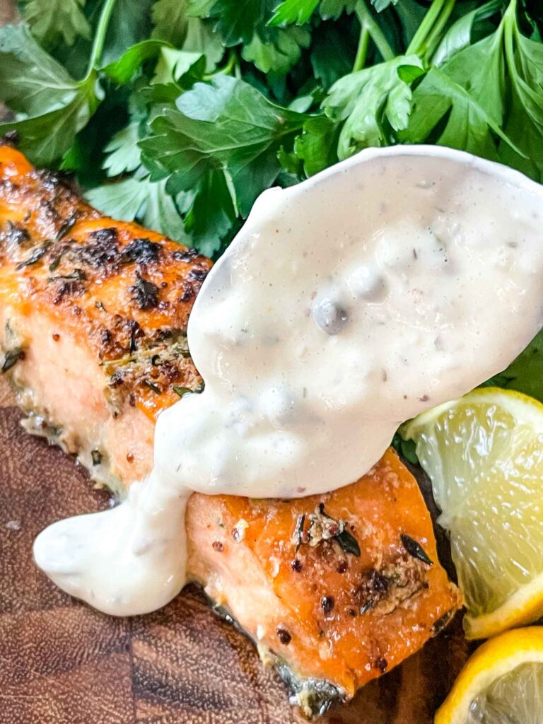 A spoon scooping remoulade sauce onto Air Fry Salmon