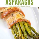 Pin of one Asparagus Wrapped in Bacon bundle on a white plate with title at top