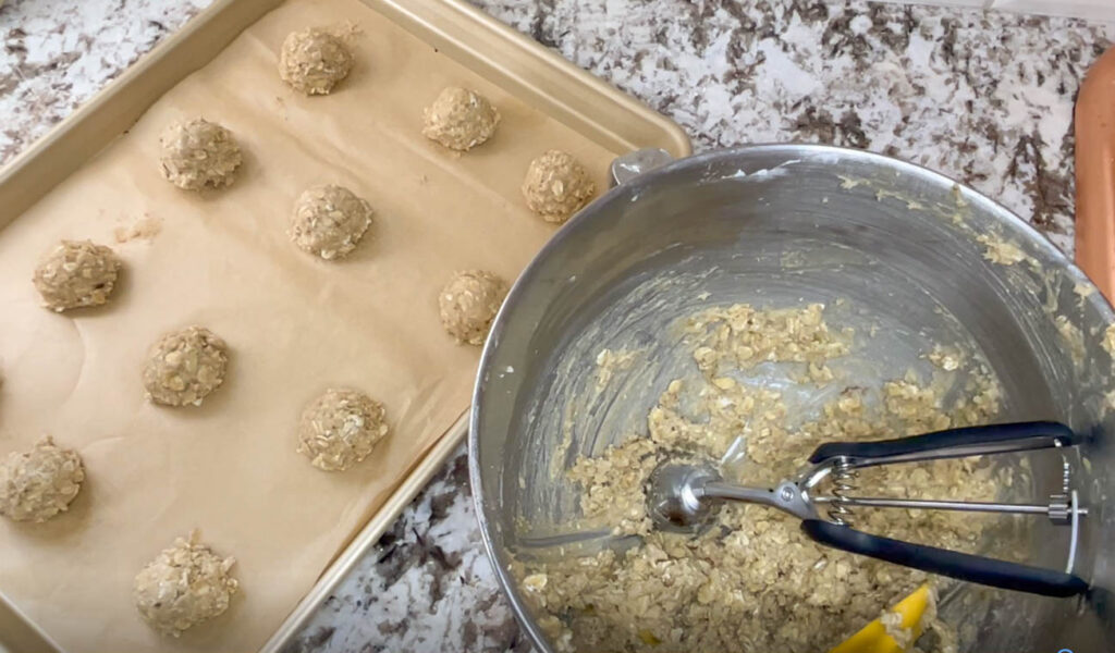 The batter being portioned and placed on a baking sheet
