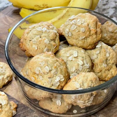 Banana Oatmeal Cookies in a glass bowl on a cutting board