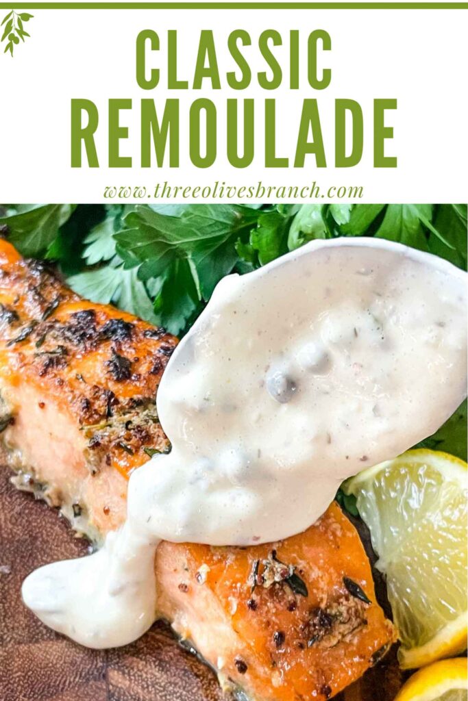 Pin of a spoon pouring Remoulade Sauce over salmon with title at top