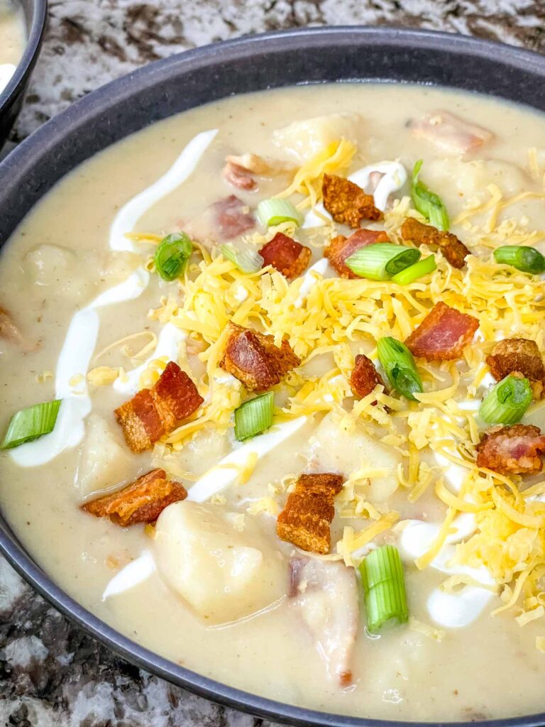 Close top view of Instant Pot Potato Soup in a gray bowl