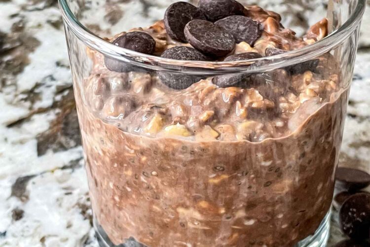Chocolate Overnight Oats in a glass jar with some chocolate chips on top