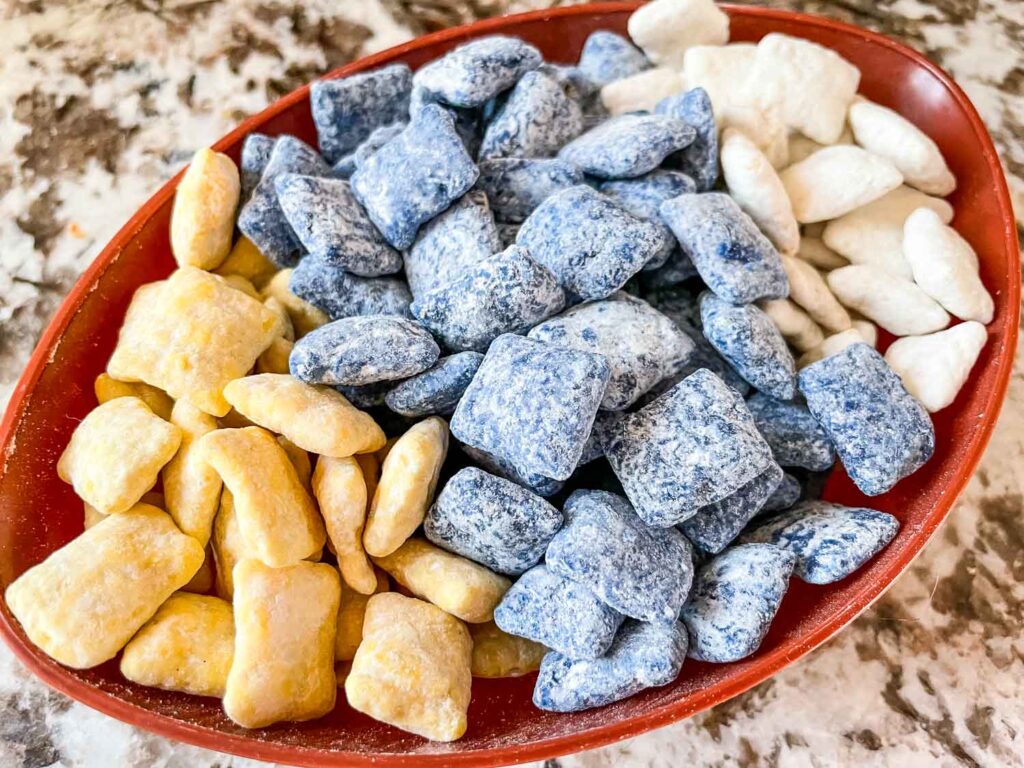 The Los Angeles Rams Puppy Chow separated by colors in a football bowl