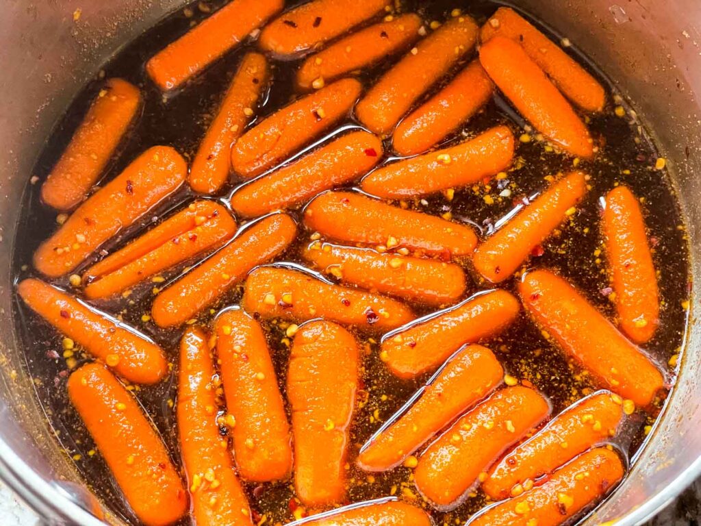 The carrots cooking in the marinade