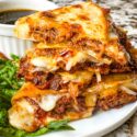 Cut pieces of Birria Quesadilla on a plate