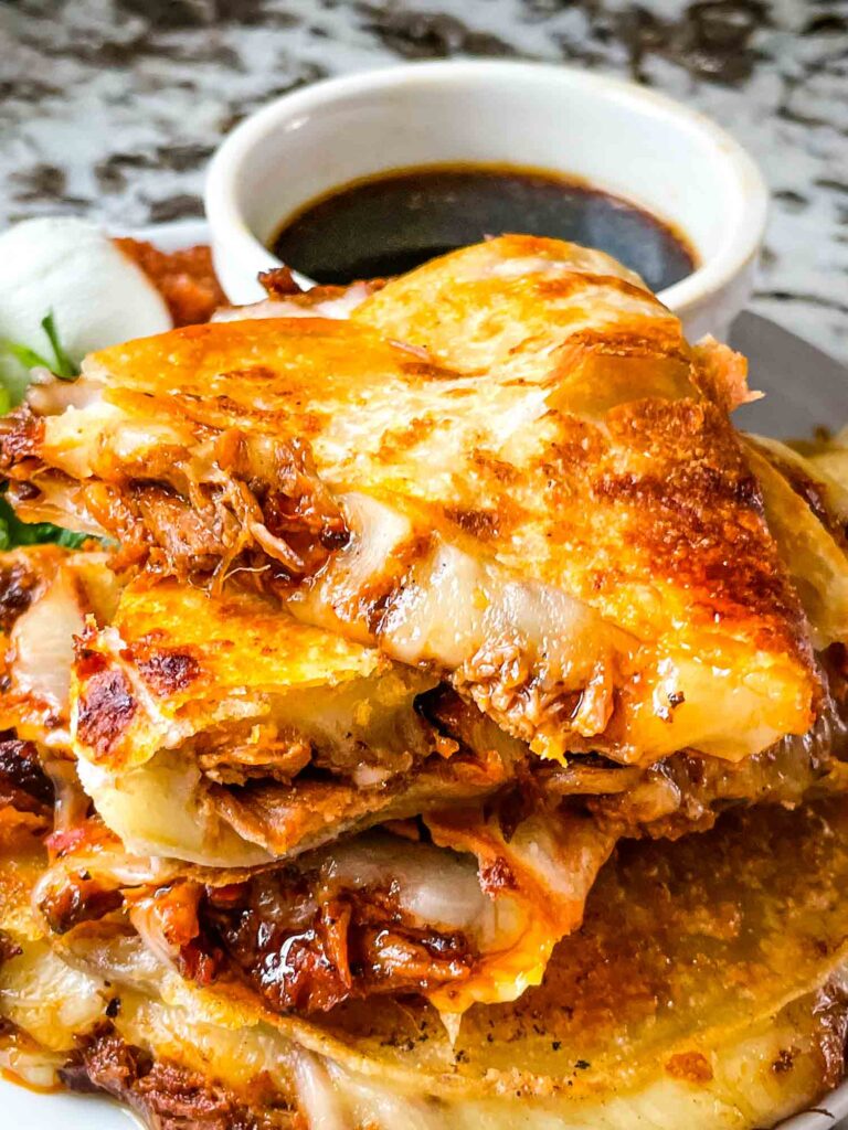 A stack of Birria Quesadillas