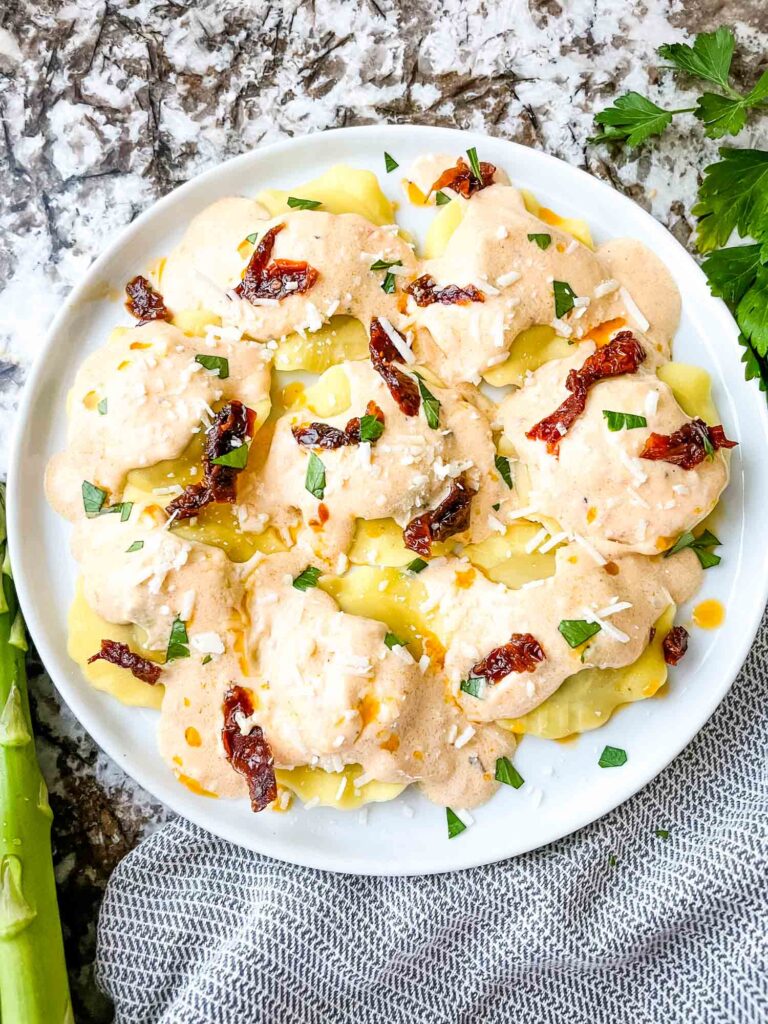 Top view of Copycat Olive Garden Ravioli Di Portobello on a white round plate