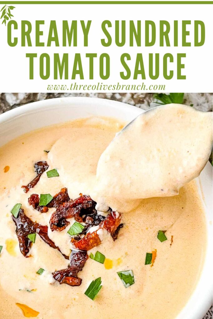 Pin of a spoon scooping into Creamy Sundried Tomato Sauce with title at top