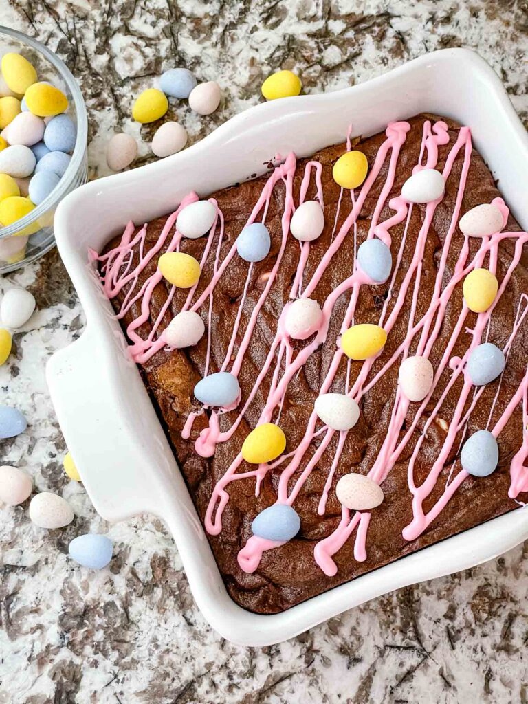 A white square dish of Mini Egg Brownies