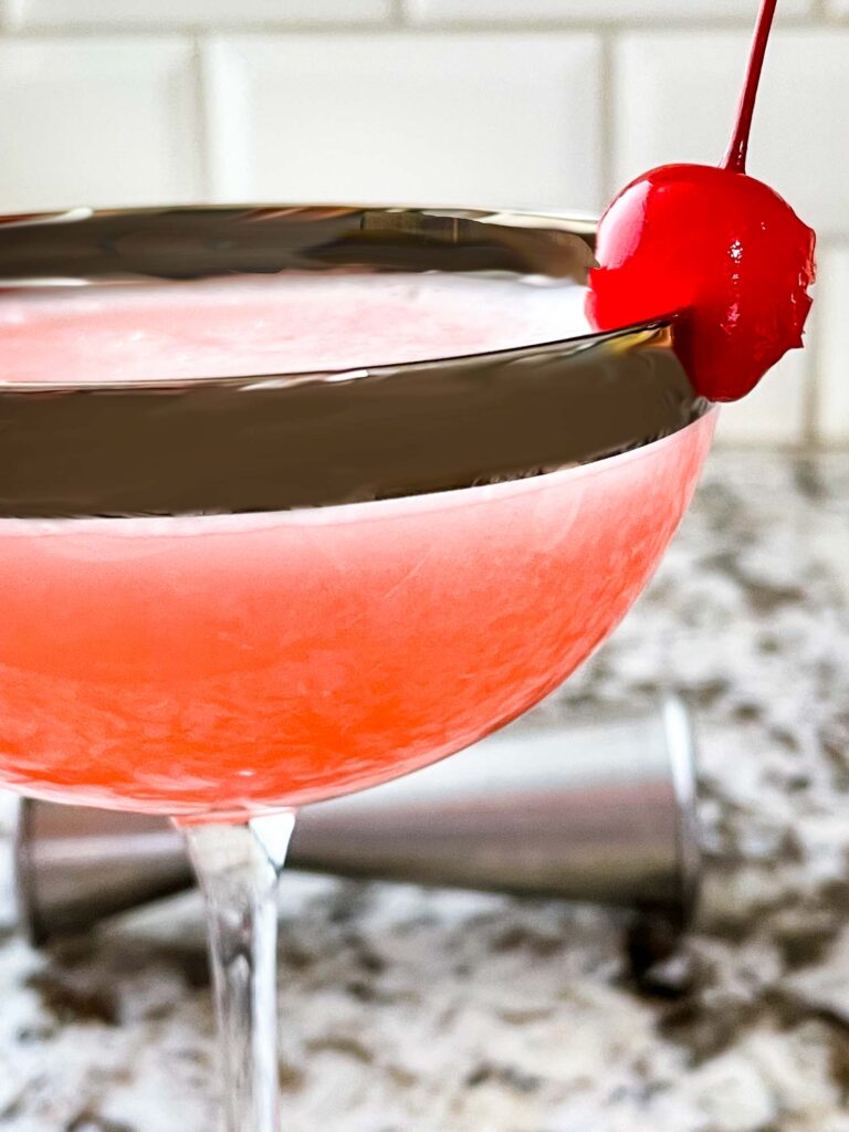 Close up of Pink Lady Cocktail in a coupe glass