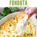 Pin of a hand dunking bread into Copycat Olive Garden Smoked Mozzarella Fonduta with title at top