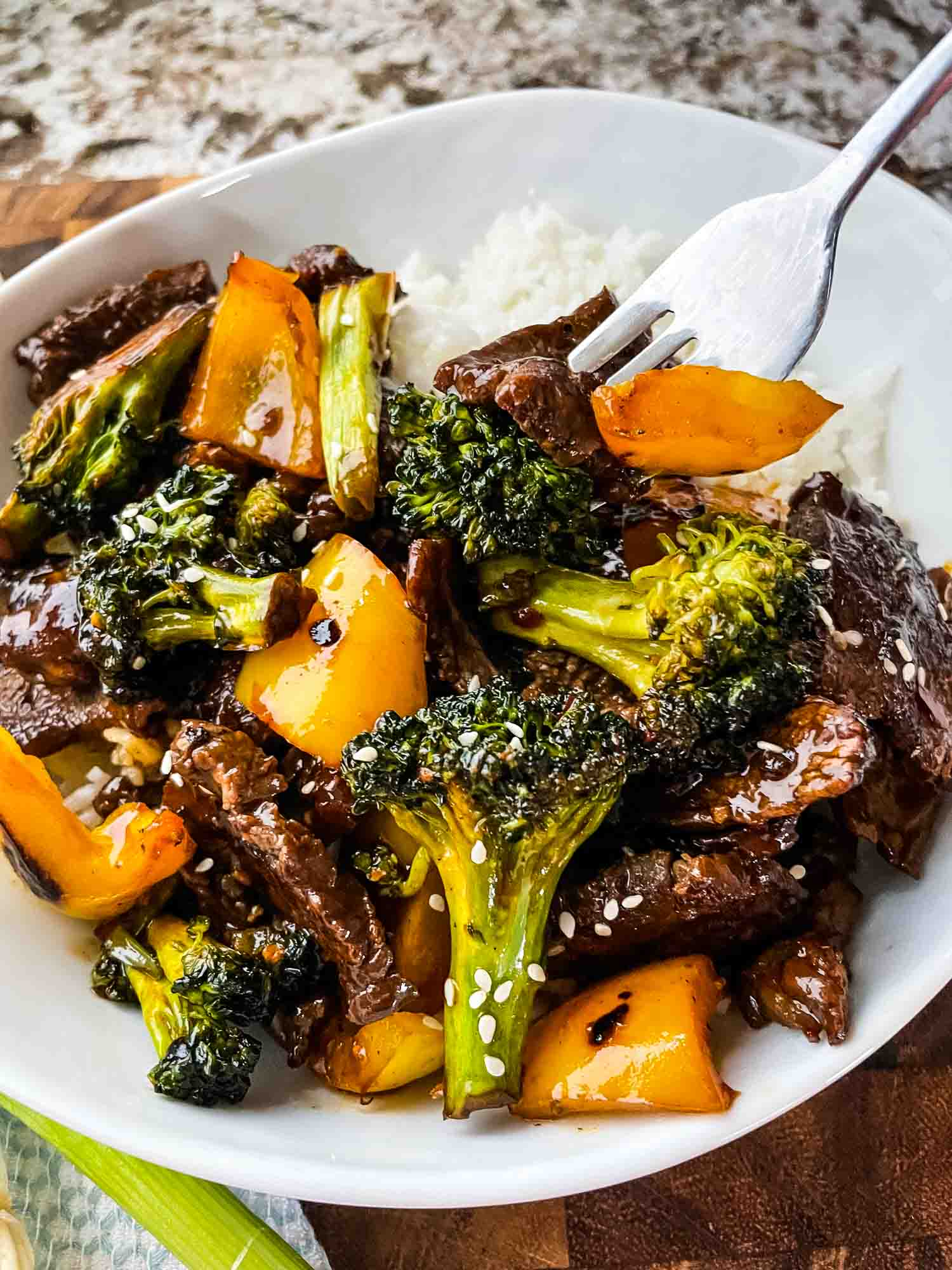 Teriyaki Beef Stir Fry in a bowl with a fork digging into it
