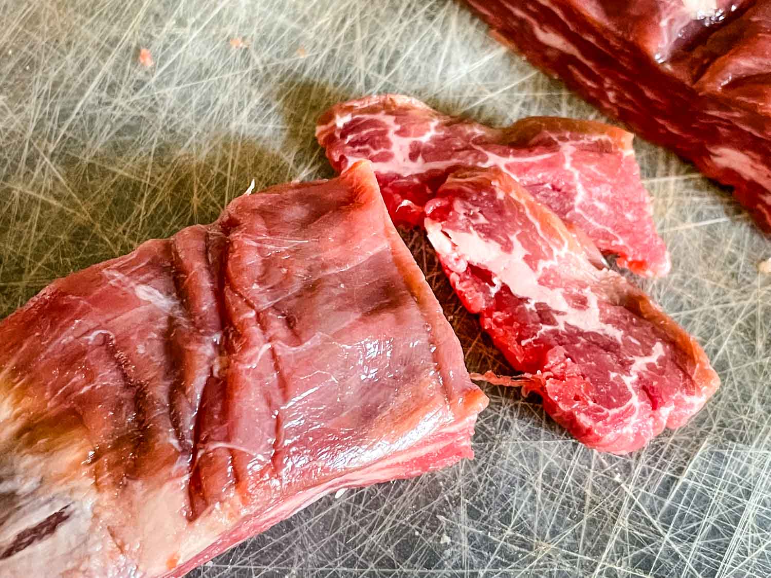 Cutting the sections of beef into slices