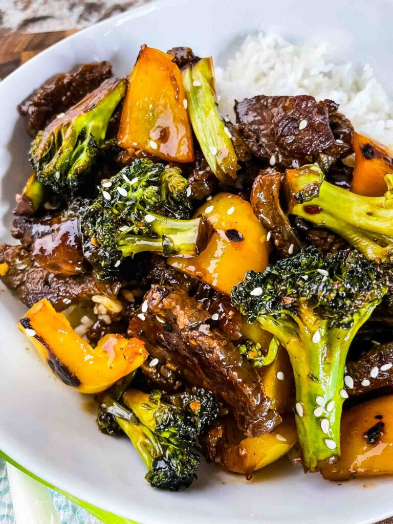 Teriyaki Beef Stir Fry on top of white rice in a bowl