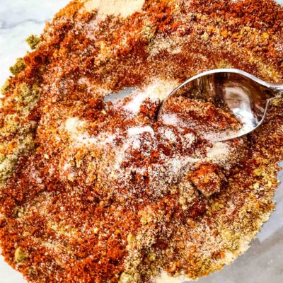 A spoon mixing the BBQ Rub spices together