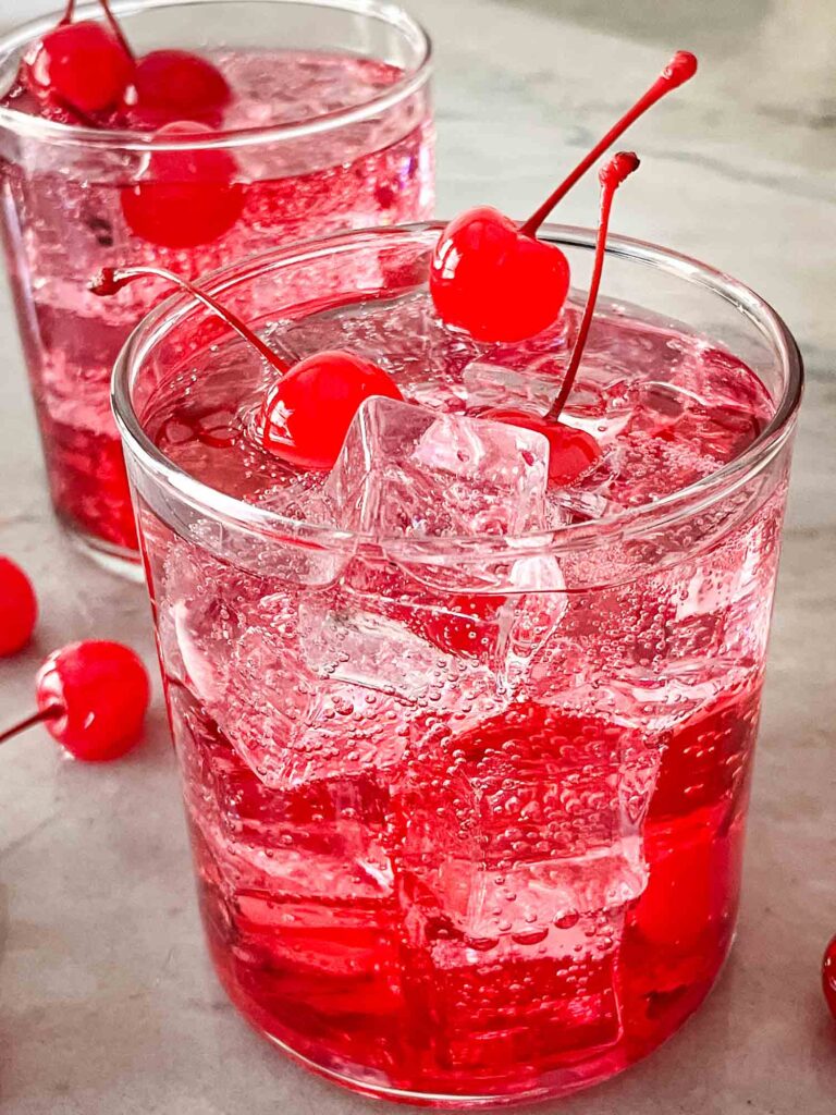 Glass of Dirty Shirley with cherries