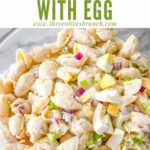 Pin of Macaroni Salad with Egg in a bowl with title at top
