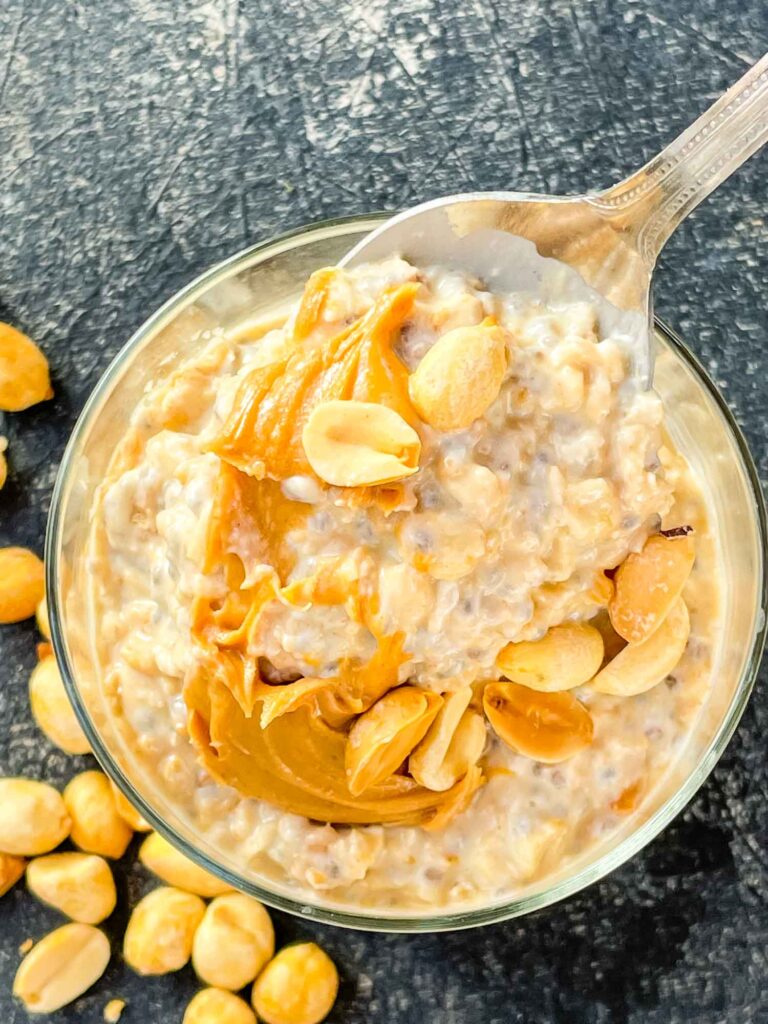 A spoon digging into Peanut Butter Overnight Oats