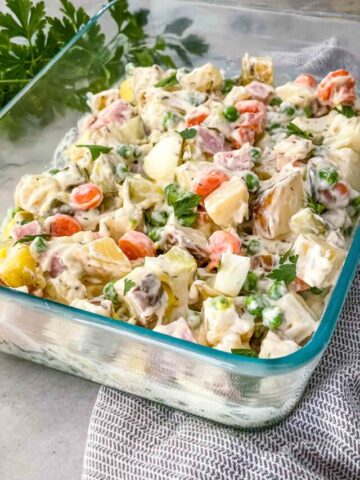 The Olivier Salad in a glass dish ready to serve